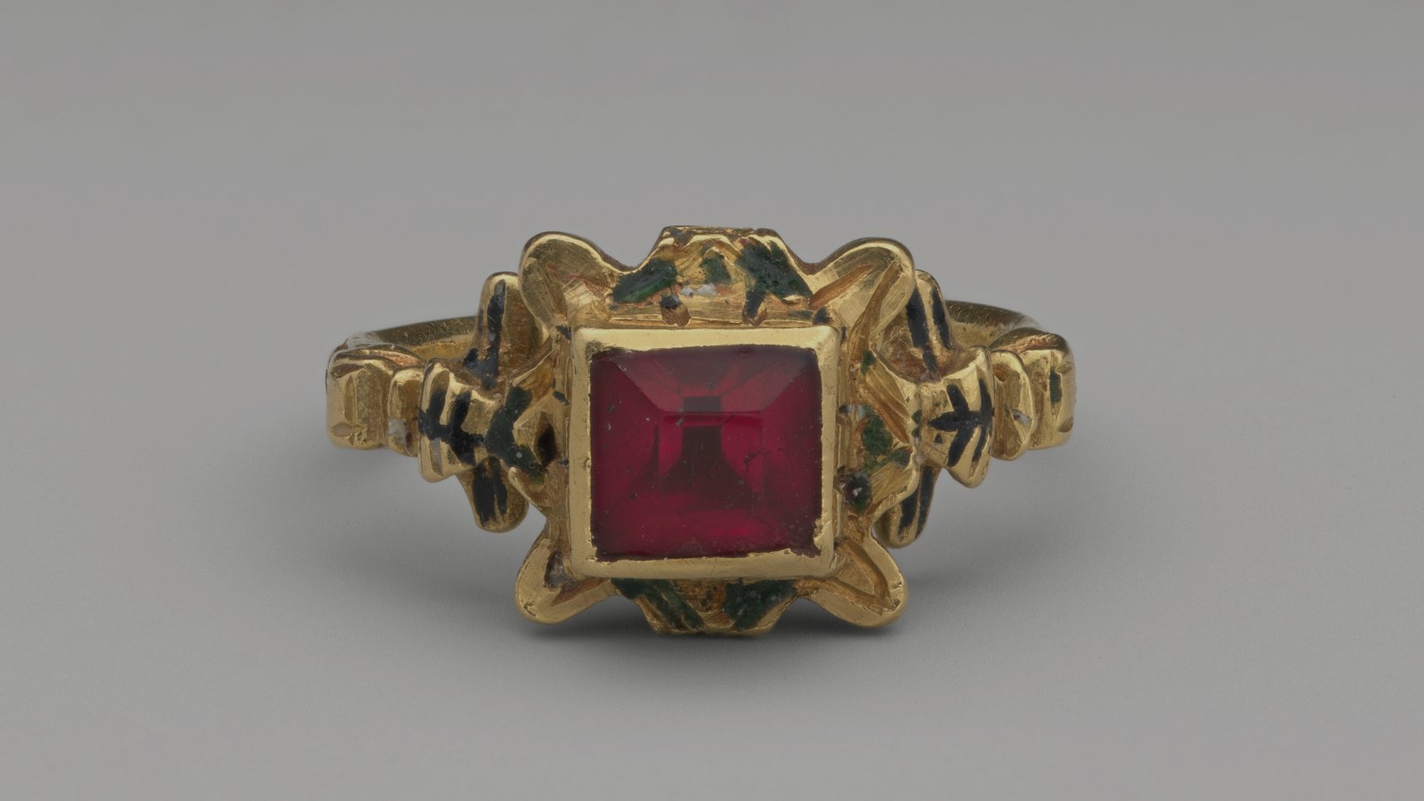 19th-century gold ring set with a red stone