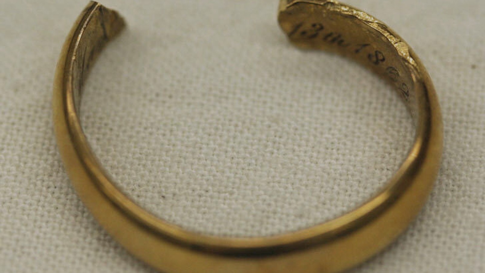 Worn gold wedding ring from 1862, engraved inside the band